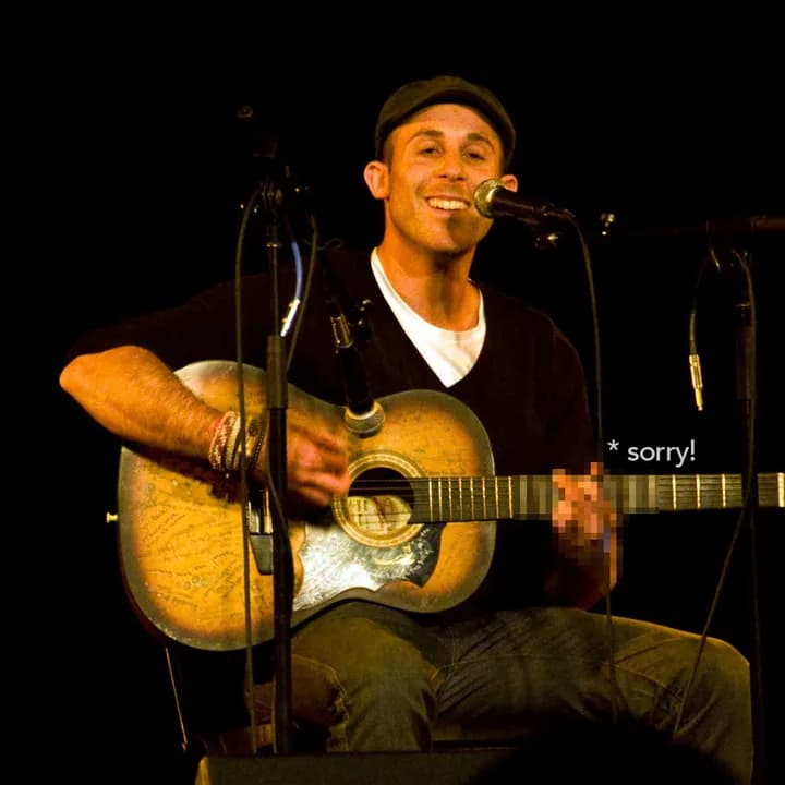 Gideon playing an open mic